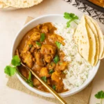 butter chicken pumpkin curry served in bowl with rice