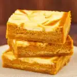 Pumpkin Cheesecake Bars on tray with fall decor