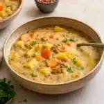 Vegetarian Lentil Soup served in a rustic bowl with bread