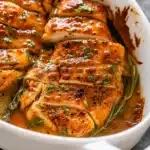 baked honey mustard chicken in white baking dish
