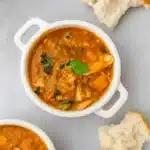 chicken lentil soup in bowl with bread