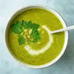 Green Goddess Soup Recipe in white bowl with herbs