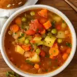 Healthy Slow Cooker Vegetable Soup in a cozy rustic setting