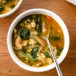 Hearty Ground Turkey Soup with Vegetables in a white bowl