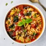 Hearty Italian White Bean Soup with Pasta served in a white bowl