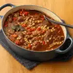 Ina Garten Beef and Barley Soup in a rustic kitchen pot