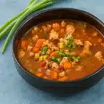 Italian Turkey Burger Soup in a bowl with herbs