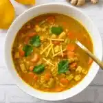 Lemon-Ginger Chicken and Rice Soup in rustic bowl
