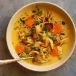 Lemon-Tahini Chicken Soup in a bowl with garnish