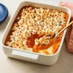 Old-Fashioned Sweet Potato Casserole topped with marshmallows and pecans