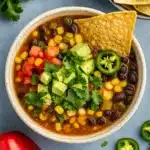 Tasty Meatless Taco Soup Recipe served with avocado and lime
