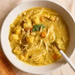 Best Anti Inflammatory Cauliflower Chicken Soup served in a rustic bowl