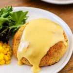 Chicken Pillows topped with creamy gravy on a rustic kitchen table