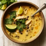 Cozy Chicken Poblano Soup served hot with fresh cilantro and lime