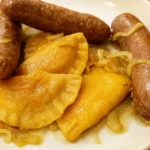 Easy Homemade Fresh Milled Flour Polish Pierogi on plate with onions