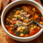 hearty minestrone soup with seasonal vegetables in rustic bowl