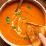 Homemade tomato soup with fresh basil and garlic