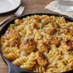 Cheesy Cajun Garlic Chicken Rotini Skillet in a cast iron pan