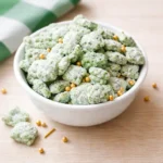 Crazy Yummy Saint Patrick’s Day Puppy Chow in a festive bowl