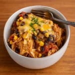 Crockpot Chicken Enchiladas Casserole served with toppings