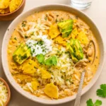 Crockpot Healthy White Chicken Chili in a bowl with toppings