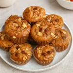 Flourless banana muffins with chocolate chips on a rustic cooling rack