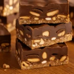 Homemade Protein Snickers Bars sliced on parchment
