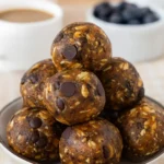 Oat Peanut Butter Date Balls displayed on a rustic table