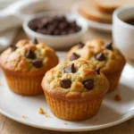 Protein muffins with oats and chocolate chips cooling on a wire rack