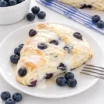 Blueberry Ricotta Scones with lemon glaze on tray