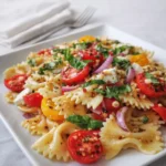 Bruschetta Pasta Salad with cherry tomatoes and basil