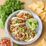 Easy Chicken Tacos served with lime and avocado