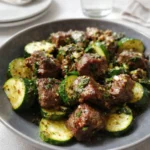 Garlic Butter Steak Bites sizzling in skillet