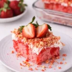 Strawberry Crunch Cake Recipe slice with fresh strawberries