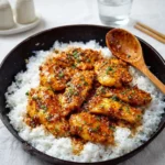 Sweet and Savory Honey Garlic Chicken in skillet with rice