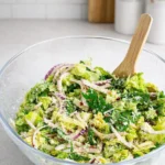 5-Minute Lemon Parmesan Lettuce Salad in a bowl with lemon and Parmesan.